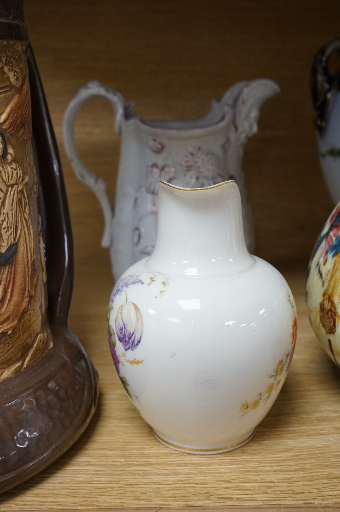 A collection of seven various ceramic vessels including Bretby, Poole, Worcester, continental art pottery etc. 26cm